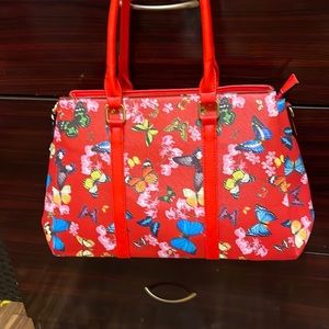 Red purse with butterfly print